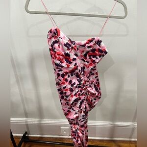 Asymmetrical pink patterned spaghetti strap dress with a side split